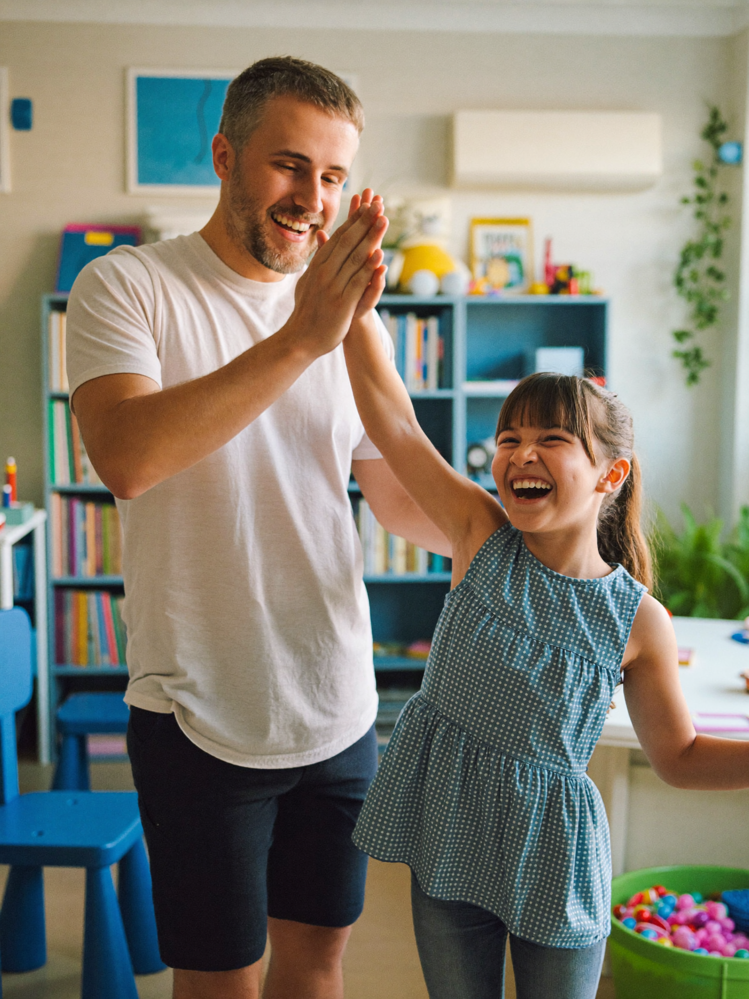 A child celebrating progress with a high five